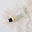 Yvonne Ellen Whale Bottle Stopper on a cloth