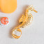 Yvonne Ellen Seahorse Bottle Opener next to a bottle