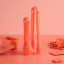 Fusion Twist Kitchens Tongs, Set of 2 - Coral on the table