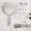 Just The Thing Mesh Sieves, Set of 3 on the kitchen counter with other kitchen tools