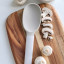 Kitchen Inspire Silicone Solid Spoon on the table