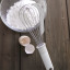 Kitchen Inspire Stainless Steel Egg Whisk with flour on the table