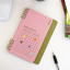 Kikkerland Habit Tracker Notebook on the table
