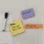 Kikkerland Memo Magnets Set on a white board 