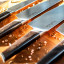 Soshida Supreme Chef Knife Set, 4-Piece on a chopping board