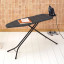 Brabantia Denim Black Ironing Board with Steam Iron Rest, 124cm x 38cm with an iron