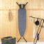 Brabantia  Denim Blue Ironing Board with Steam Iron Rest, 110cm x 30cm against a wall