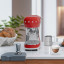 Smeg Retro Manual Espresso Coffee Machine - Fiery Red on the kitchen counter