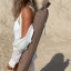 Sunnylife Compact Beach Umbrella - Rustico Driftwood packaging carried at the beach