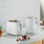 Kenwood Eterna 2-Slice Toaster, 930W - White on the kitchen counter with a kettle