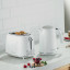 Kenwood Eterna Cordless Electric Kettle, 1.7L - White with a toaster on the kitchen counter