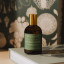 Amanda Jayne Kitchen Corner Lemongrass, Rosemary & Pink Grapefruit Home Fragrance, 100ml showing scale on a book