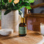 Amanda Jayne Kitchen Corner Lemongrass, Rosemary & Pink Grapefruit Home Fragrance, 100ml on the table