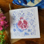 Growing Paper Pomegranate Greeting Card on the table