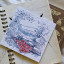 Growing Paper Picnic Greeting Card on a bok showing scale