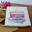 Growing Paper Coffee and Books Greeting Card on the table