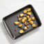 Kitchen Pro Bakewell Roasting Pan, 35cm with roasted potatoes