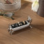 Umbra Ali Ring Holder - Chrome with rings on a desk
