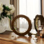 Umbra Ferris Ring Holder - Walnut with rings on a dressing table