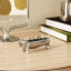 Umbra Dachsie Ring Holder - Chrome with rings on a desk