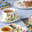 Maxwell & Williams Eloise Short Lyric Cup & Saucer, 240ml - Regent Honeyeater with tea on the table