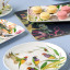 Maxwell & Williams Eloise Short Lyric Coupe Plate, 20cm - Gouldian Finch on the table