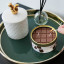 CandleCan Chocolate Bar Scented Candle on a side table