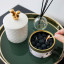 CandleCan Cinnamon Blackberry Scented Candle on a side table