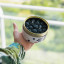 CandleCan Cinnamon Blackberry Scented Candle handheld showing scale