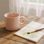 Nicolson Russell Getty Mug, 230ml - Pink Beige on a table