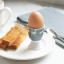 KitchenCraft Porcelain Goose Egg Cup on a plate