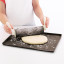 Lekue Silicone Rectangular Pizza Crisper Mat with pizza dough