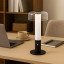 Arc & Hue Arcis Portable & Rechargeable LED Lamp - Black on a desk