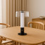 Arc & Hue Arcis Portable & Rechargeable LED Lamp - Black on a dinner table