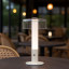 Arc & Hue Arcis Portable & Rechargeable LED Lamp - Cream on a dinner table