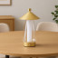 Arc & Hue Shoji Portable & Rechargeable LED Lamp - Gold on the table