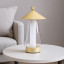 Arc & Hue Shoji Portable & Rechargeable LED Lamp - Gold on a side table