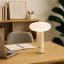 Arc & Hue Oliver Portable & Rechargeable LED Lamp - Cream on a desk