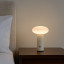Arc & Hue Oliver Portable & Rechargeable LED Lamp - Cream on a nightstand