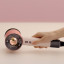 Dyson Supersonic Nural Hair Dryer - Ceramic Pink/Rose Gold handheld showing scale
