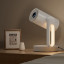 Etoe Starfish Google Certified 4K Android Smart TV Projector on a nightstand