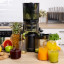 OmniBlend OmniJuice Cold Press Juicer with glasses of juice