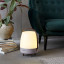 Kooduu Lite-Up Play JBL Speaker & Lamp - White/Earth next to a couch