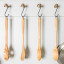 KitchenAid Birchwood Utensils, Set of 4 on a kitchen hanger