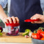 KitchenAid Hand Pull Food Chopper with red onion