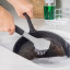 KitchenAid Cast Iron Cleaner Brush in a sink 