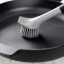 KitchenAid Cast Iron Cleaner Brush on a pan