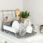 KitchenAid Expandable Dish Drying Rack with dishes and glasses