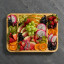 Farberware Build-a-Board Bamboo Rectangular Board - 30.5cm on the table with fruits