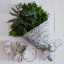 Talking Tables Botanical Mistletoe Wrapping Paper Roll, 3m on the table